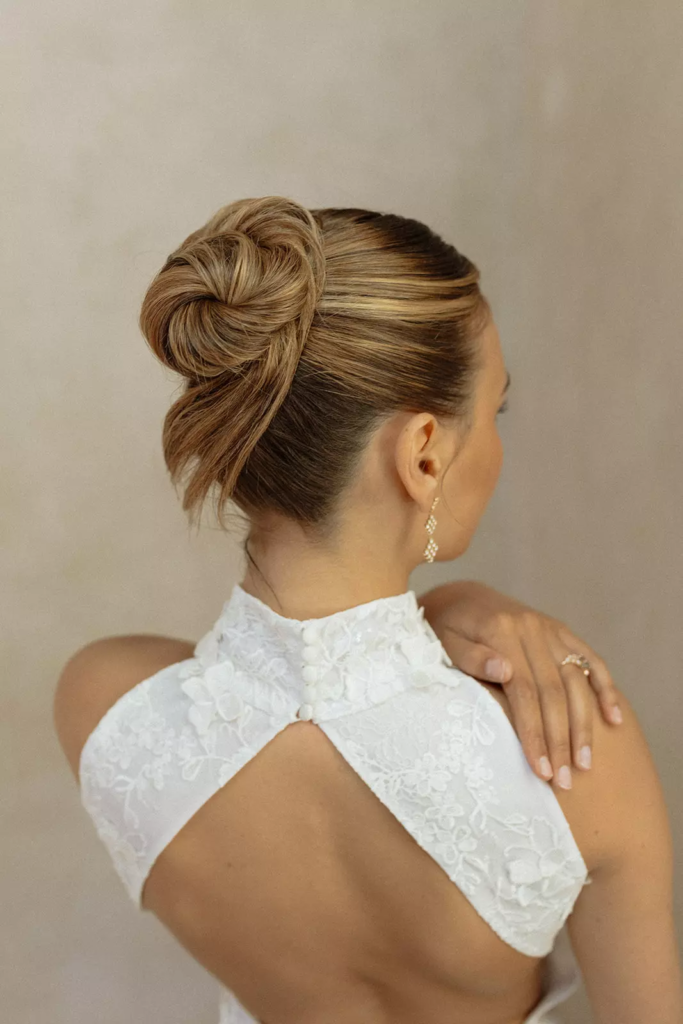 Close up of sculpted bridal bun showcasing precision hairstyling by Mandy Dorian at Château de Villette