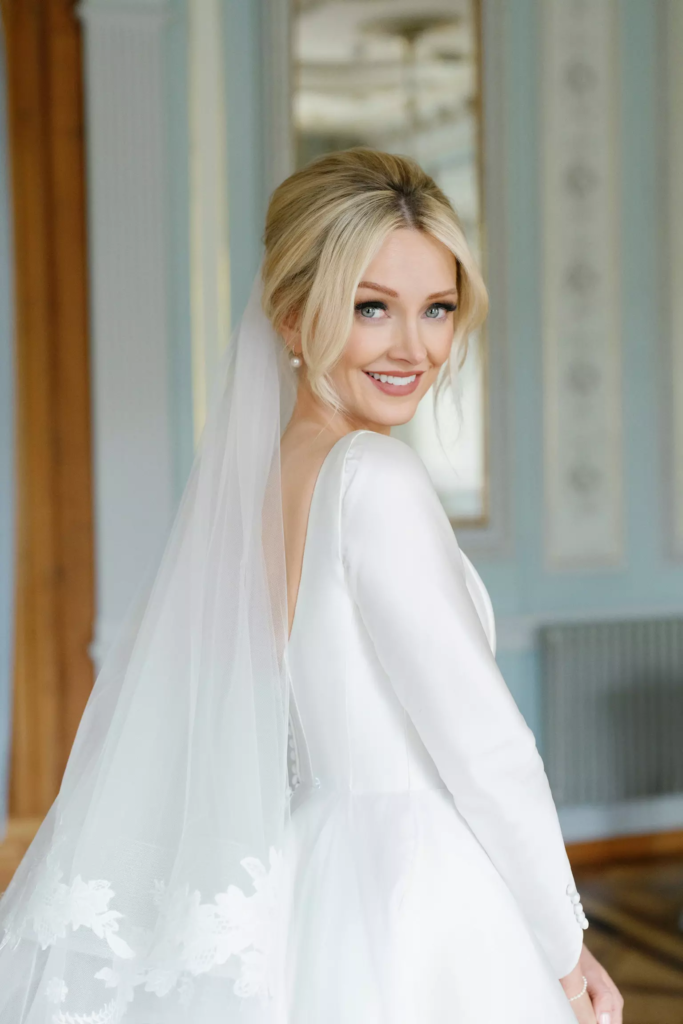 Bride Katherine with luminous skin and refined bridal hairstyle created by Mandy Dorian luxury bridal hair and makeup artist in France