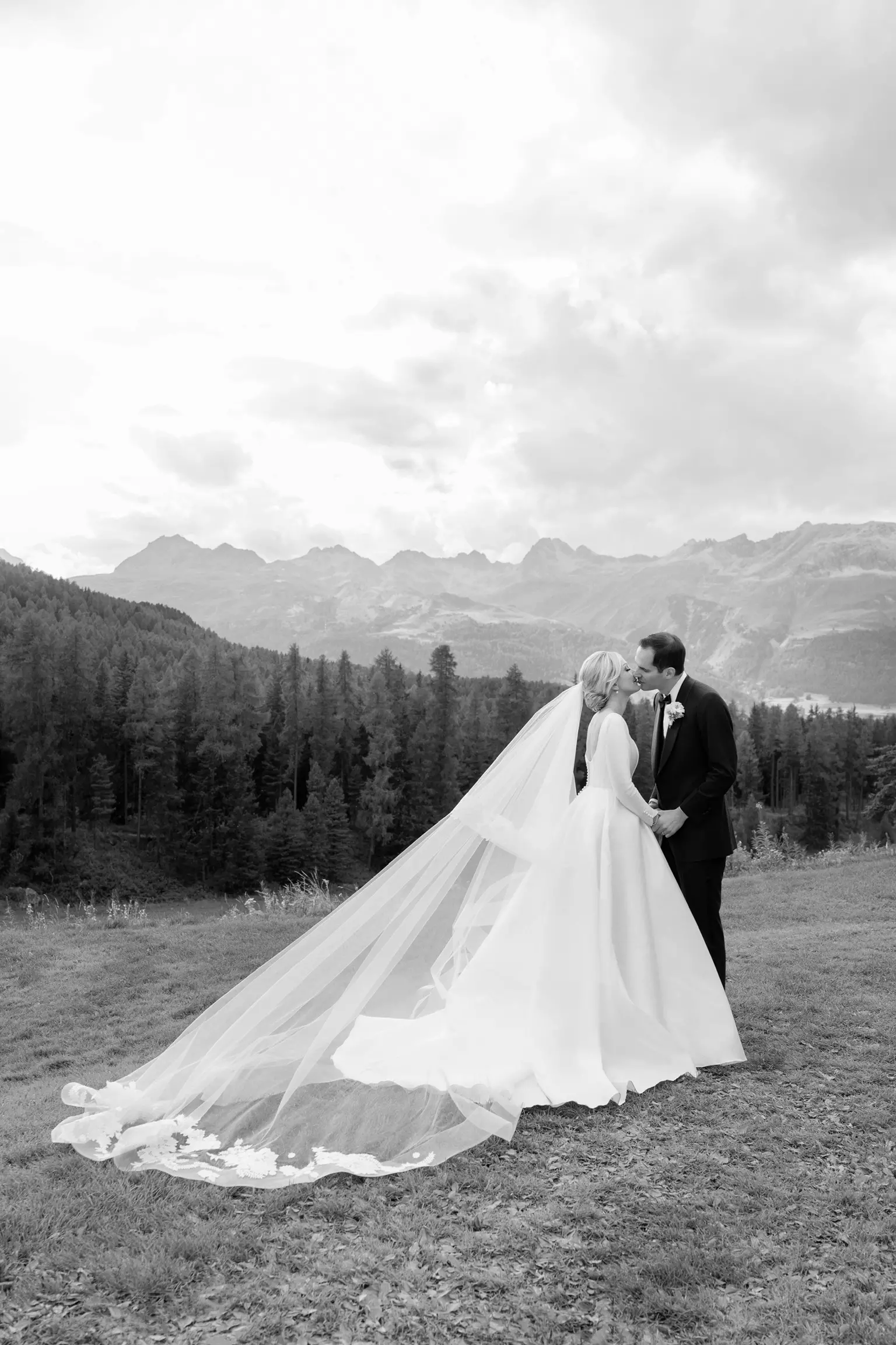Bride and groom portrait in the Swiss Alps featuring bridal beauty styling by Mandy Dorian luxury destination hair and makeup artist