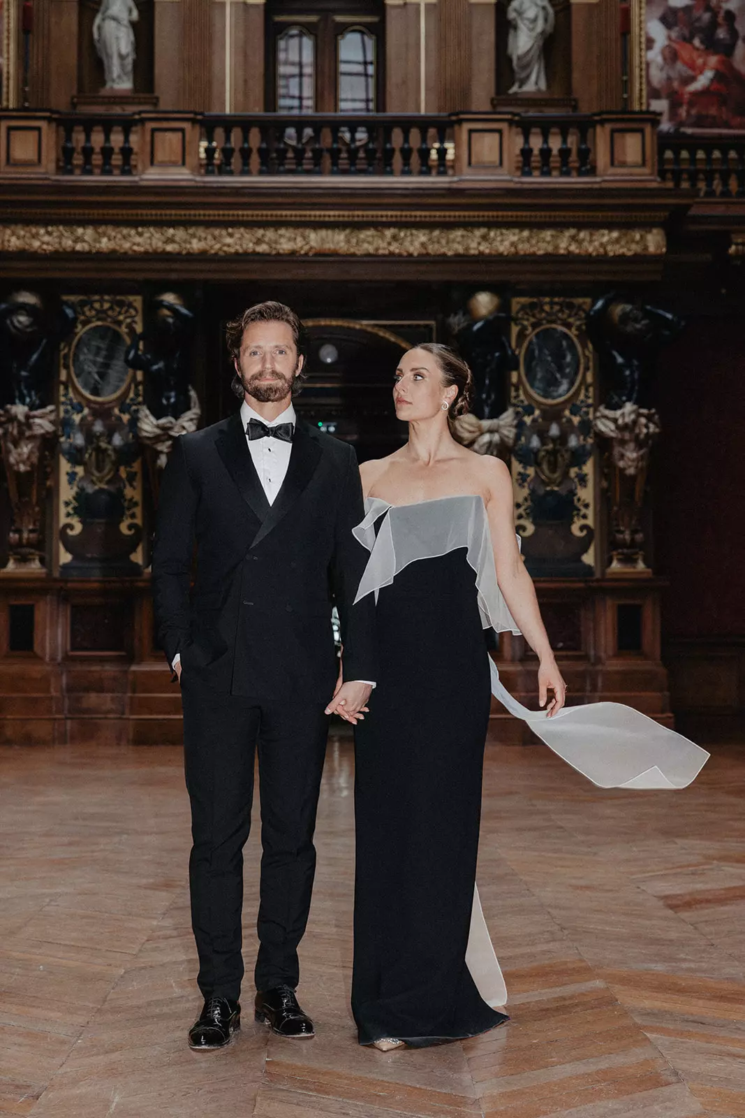 Bride and groom walking inside château featuring refined bridal beauty styling by Mandy Dorian