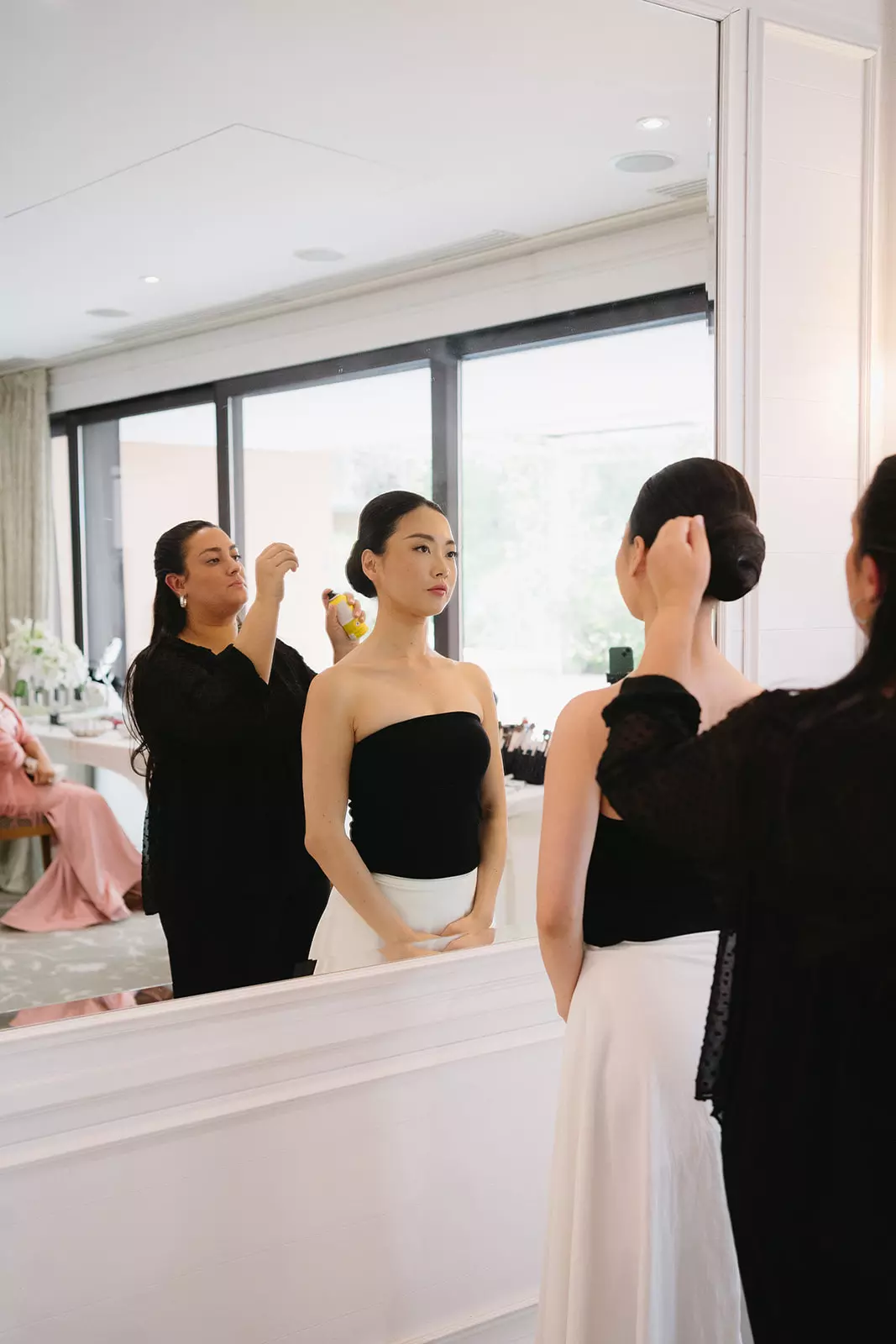 Mandy Dorian applying soft natural makeup to bride before ceremony at Cap-Ferrat