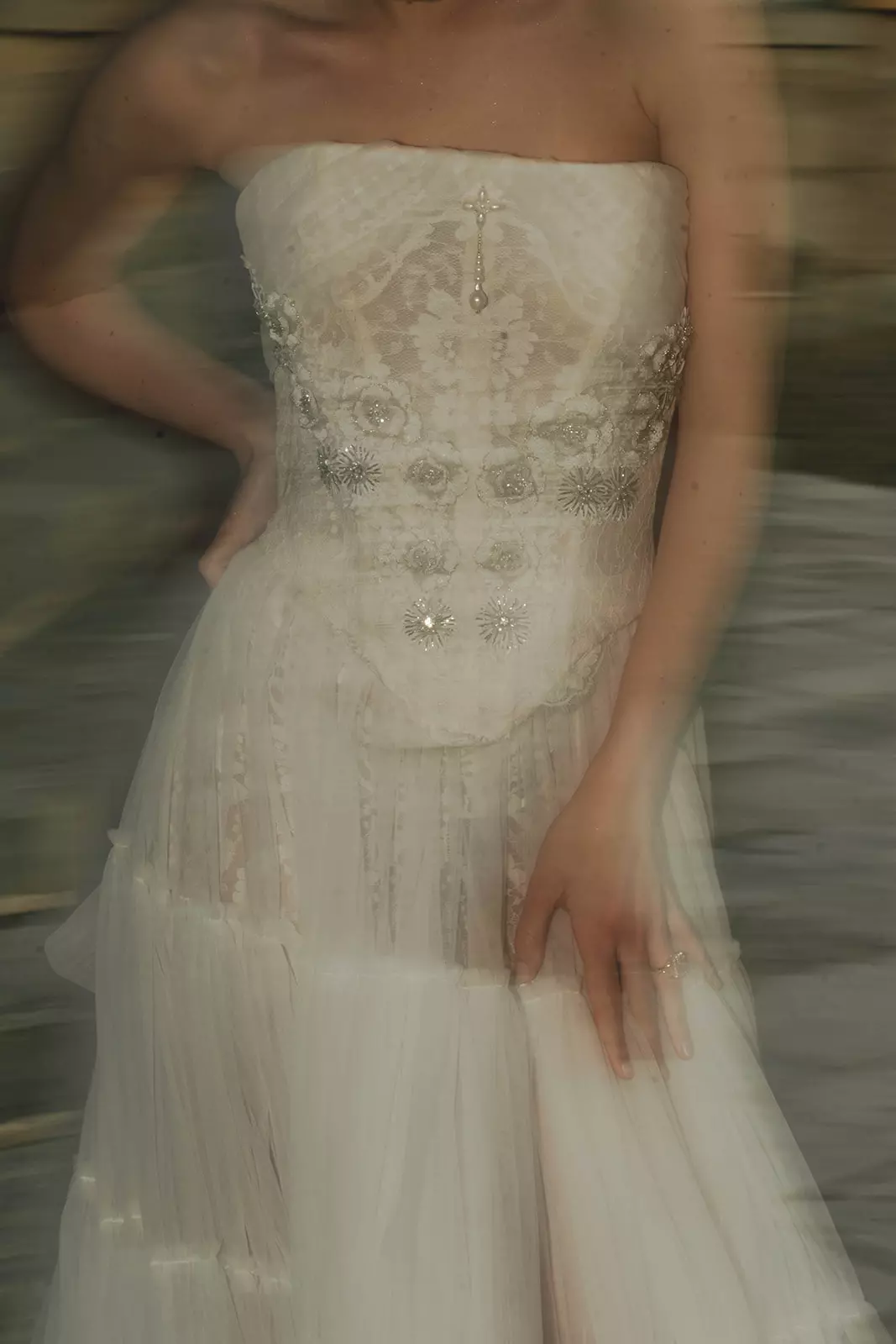 Close up of embroidered bridal gown highlighting couture wedding aesthetic at Château de Villette