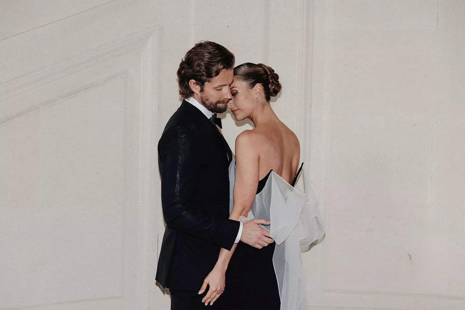 Bride and groom standing together with balanced bridal beauty look and timeless elegance