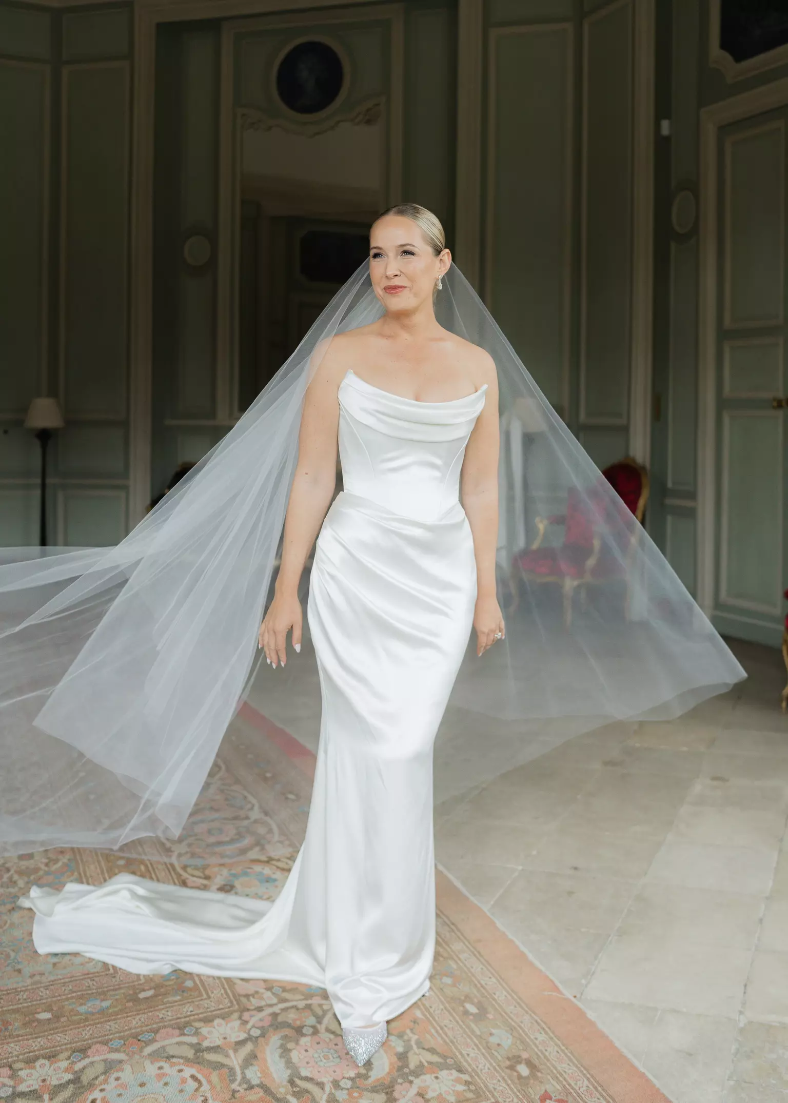 Bride wearing veil with refined bridal hair and makeup by Mandy Dorian luxury artist traveling across France