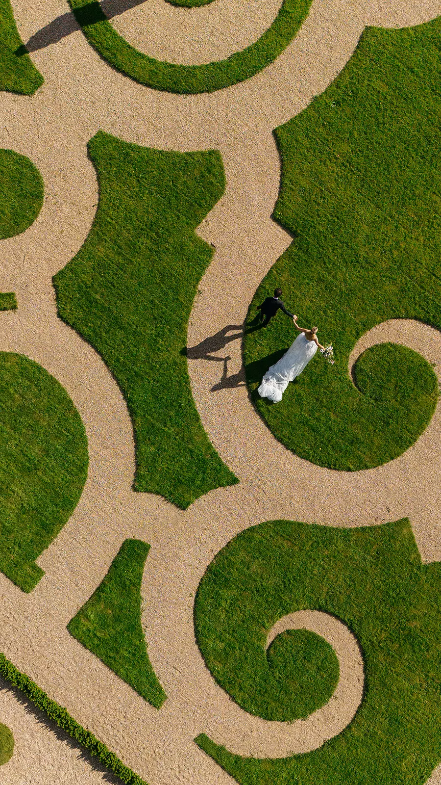 Aerial view of château gardens setting the scene for luxury bridal editorial in France