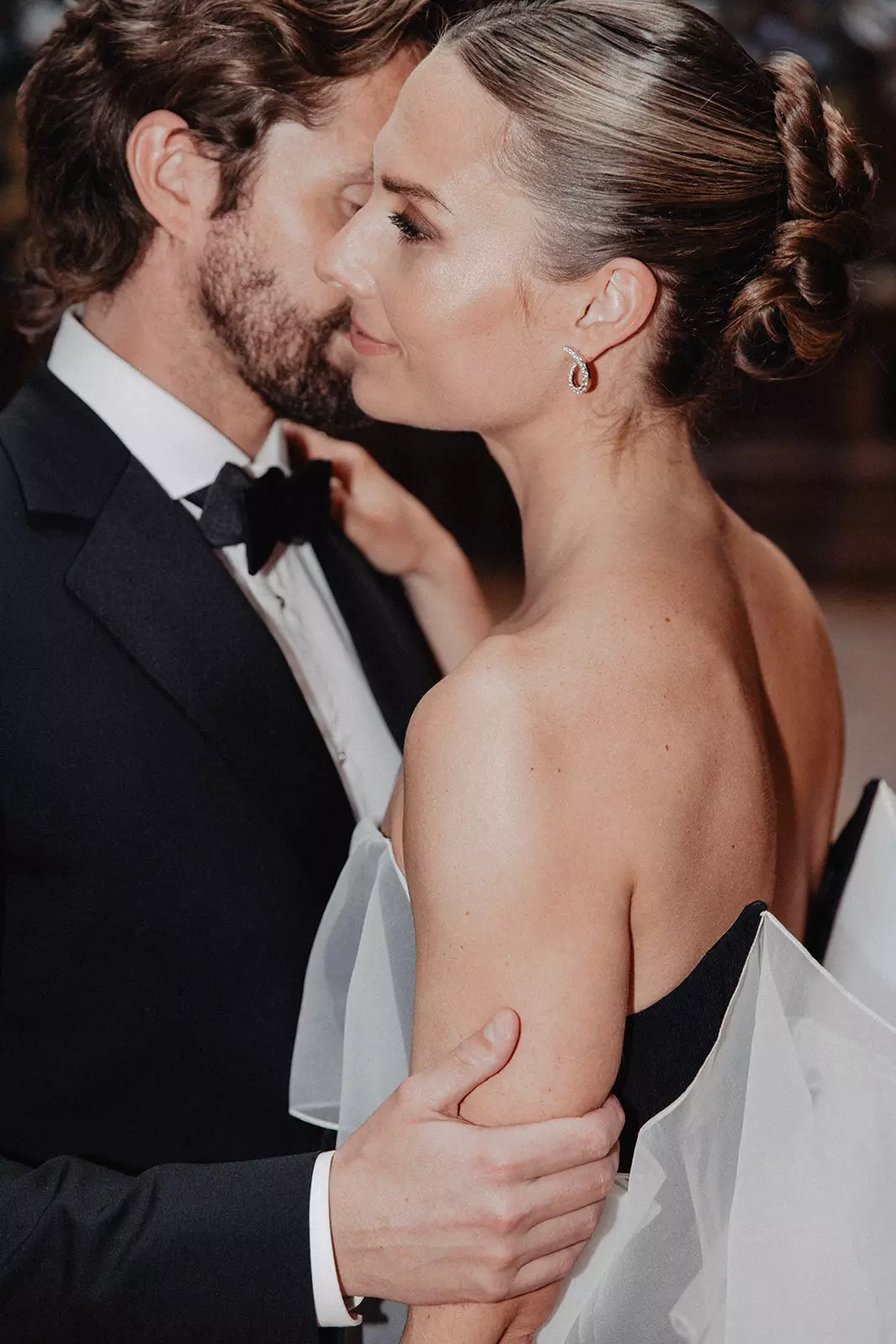 Close up of bride in structured gown highlighting luminous skin and precise bridal makeup