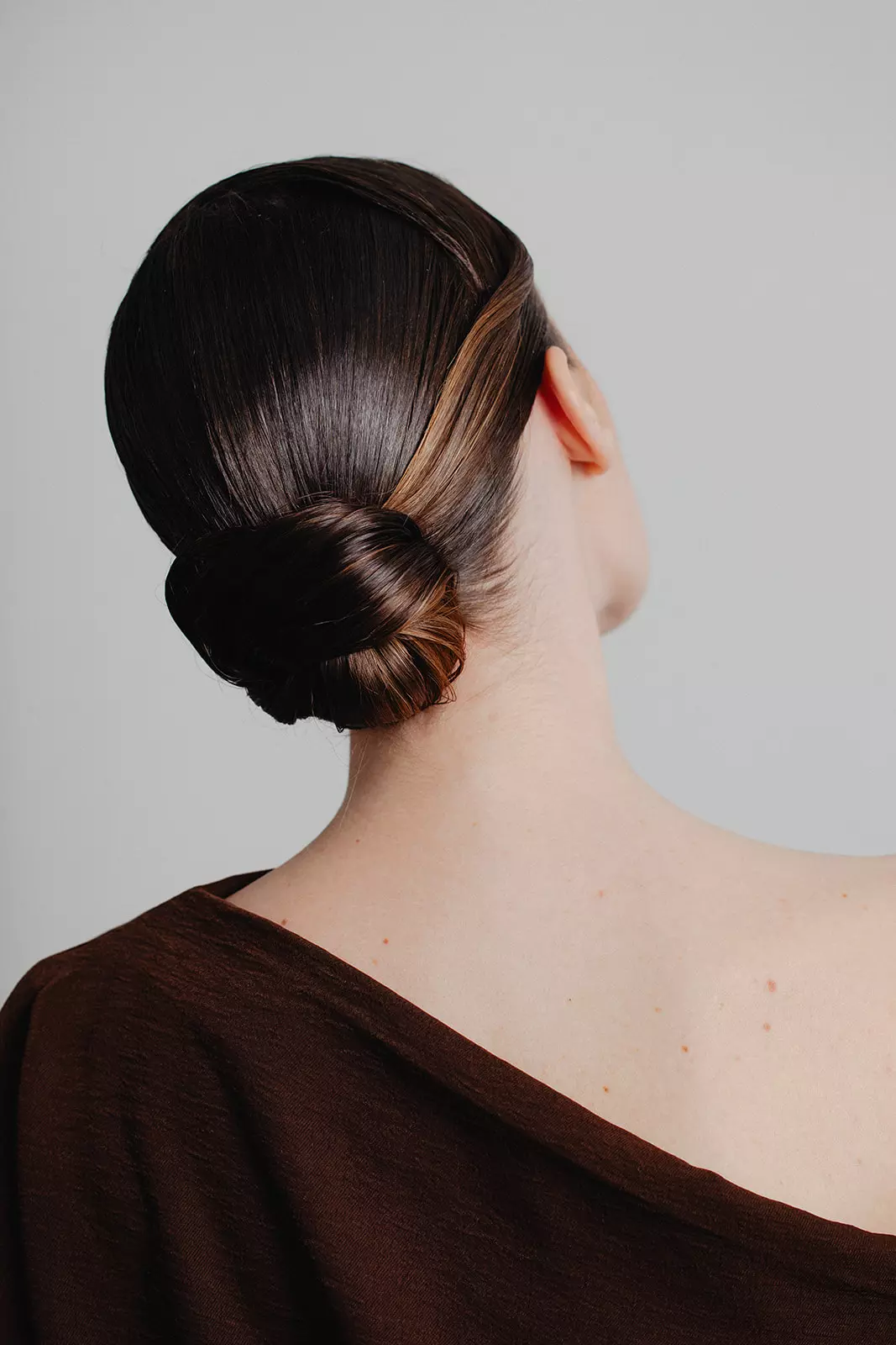 Close view of structured low bun created by Mandy Dorian for fashion beauty editorial