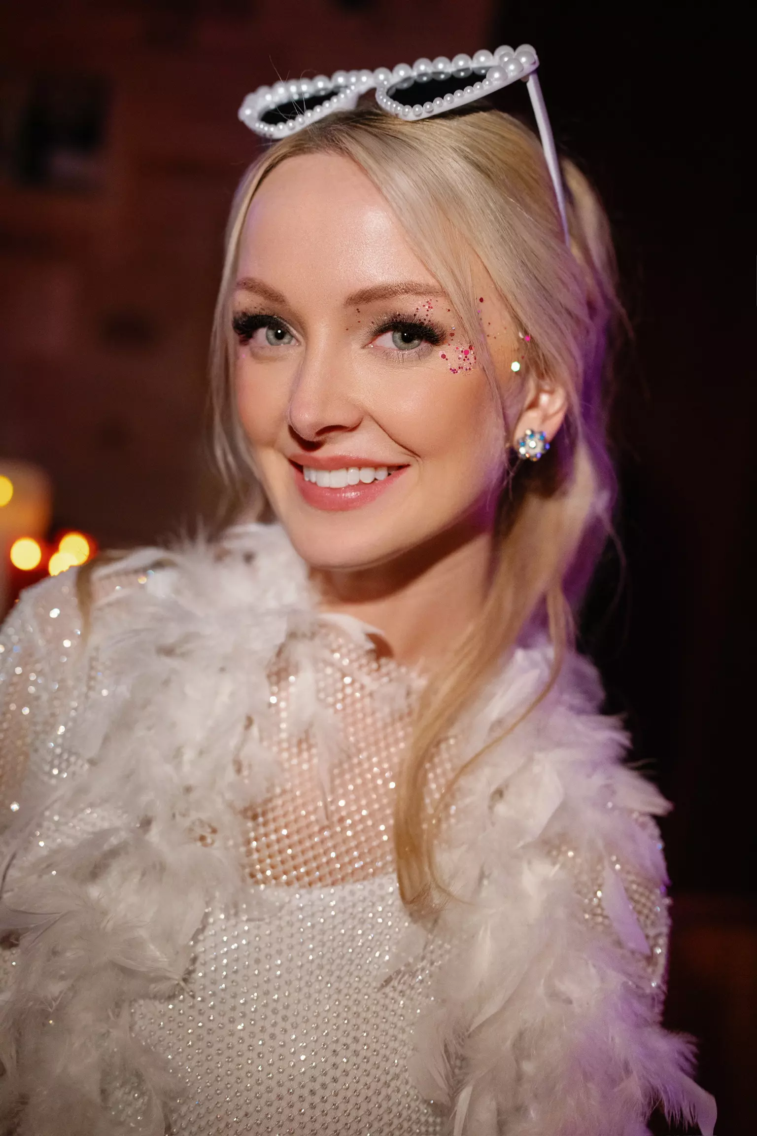 Bride Katherine wearing sparkling hair accessory with elevated evening bridal makeup look
