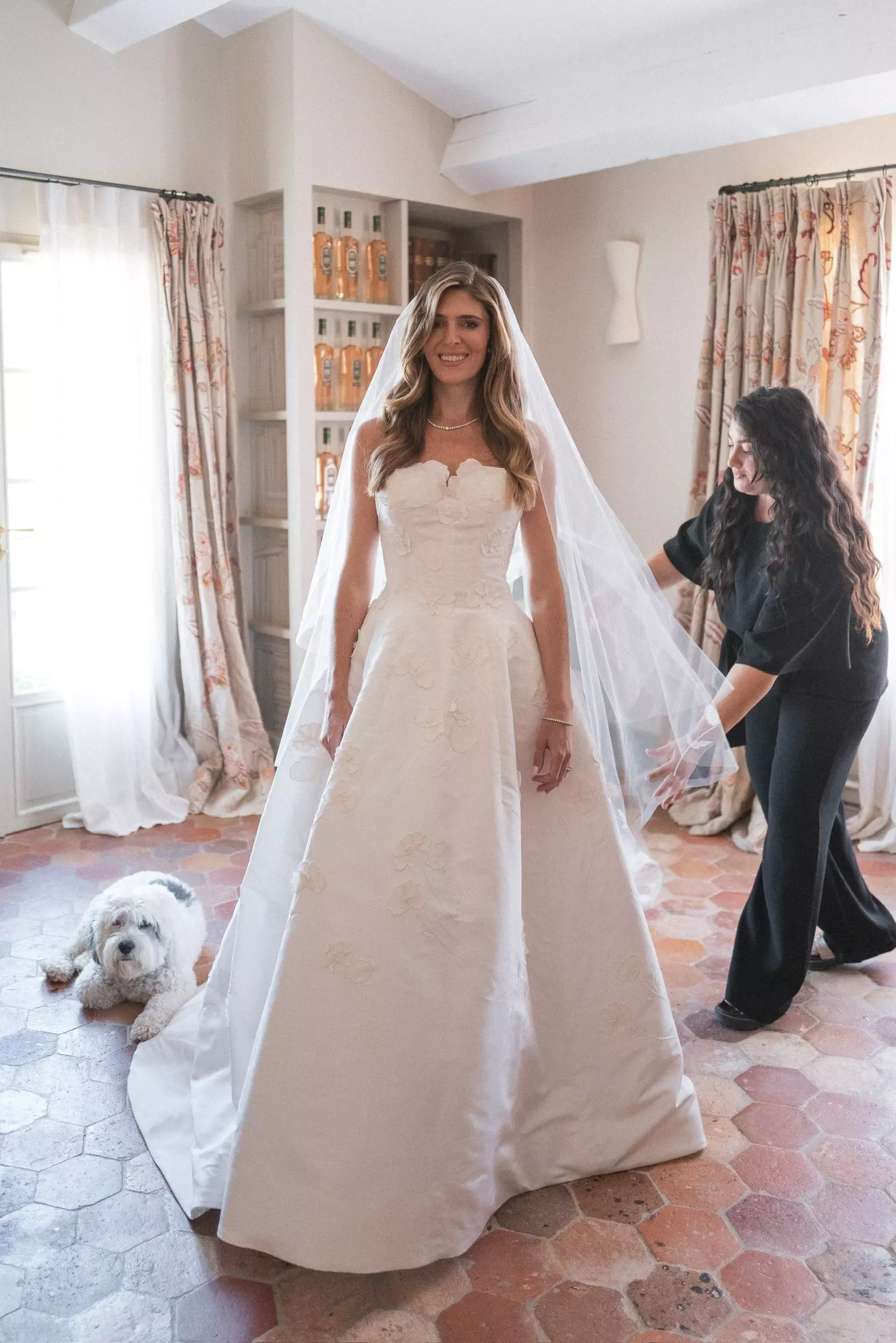 Mandy Dorian styling bride’s hair before ceremony at Château de Berne