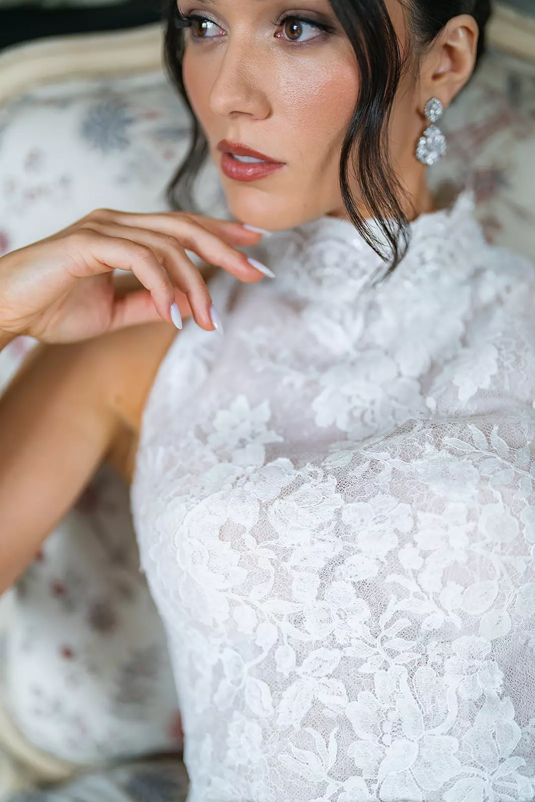 Close up of bride wearing lace high neckline with luminous natural bridal makeup