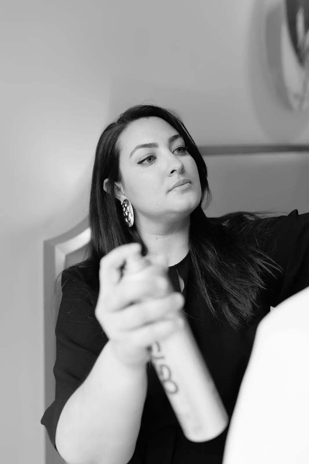 Mandy Dorian applying finishing spray during fashion editorial photoshoot